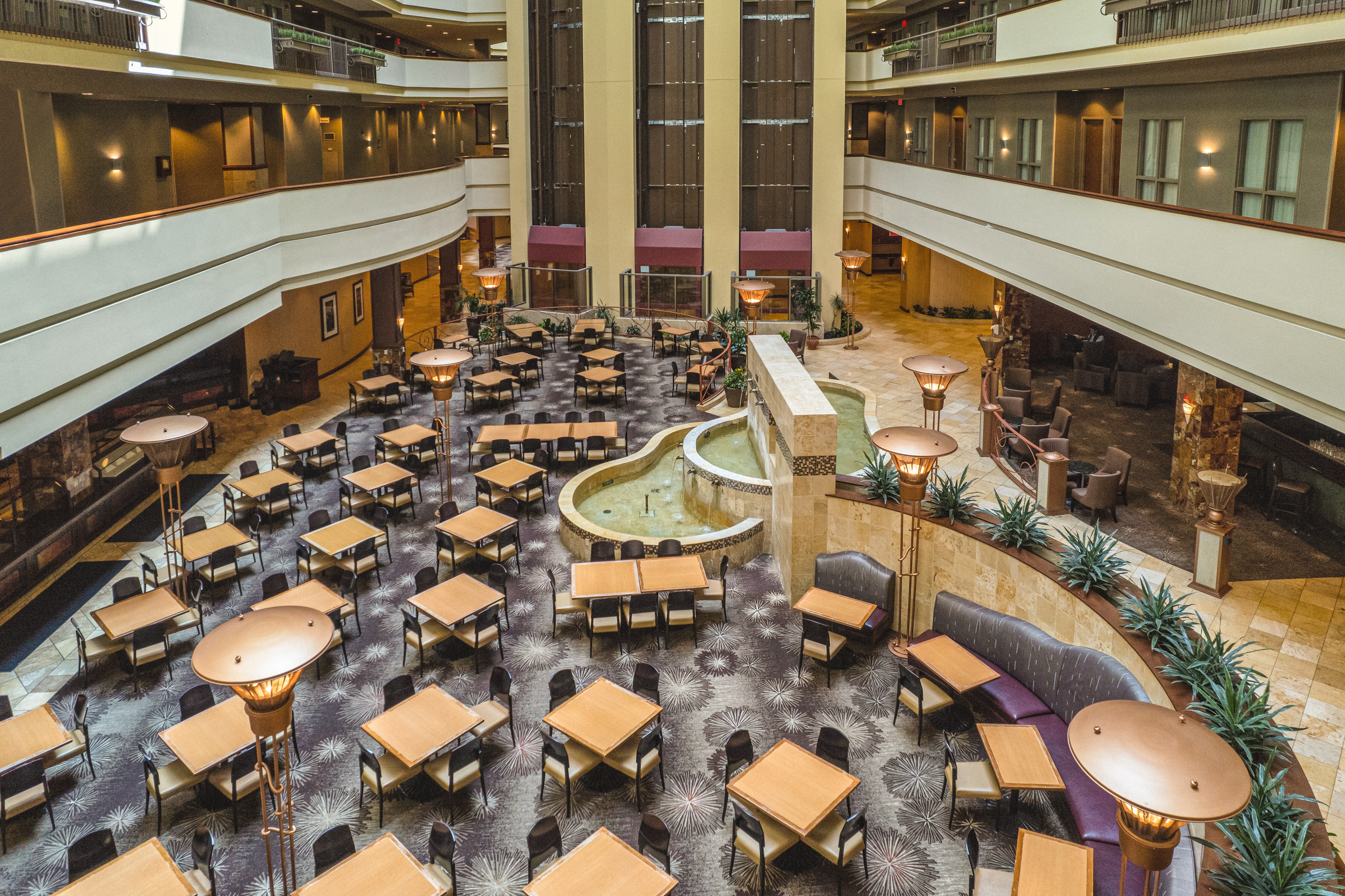 Hotel Atrium space with tables and chairs