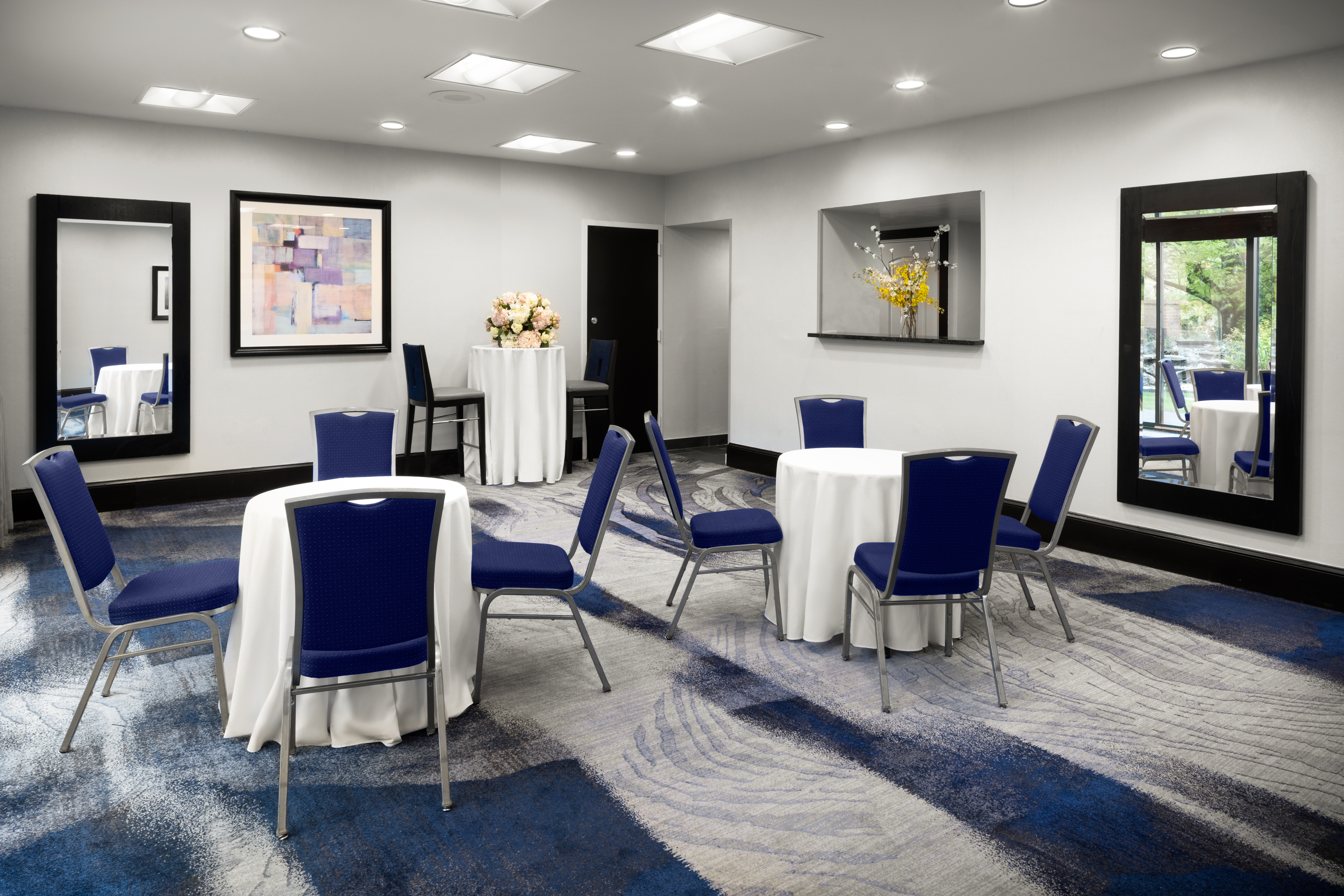 Meeting Room with Small Round Tables and Chairs